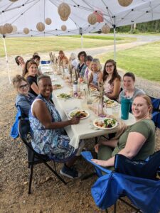 women posing with food